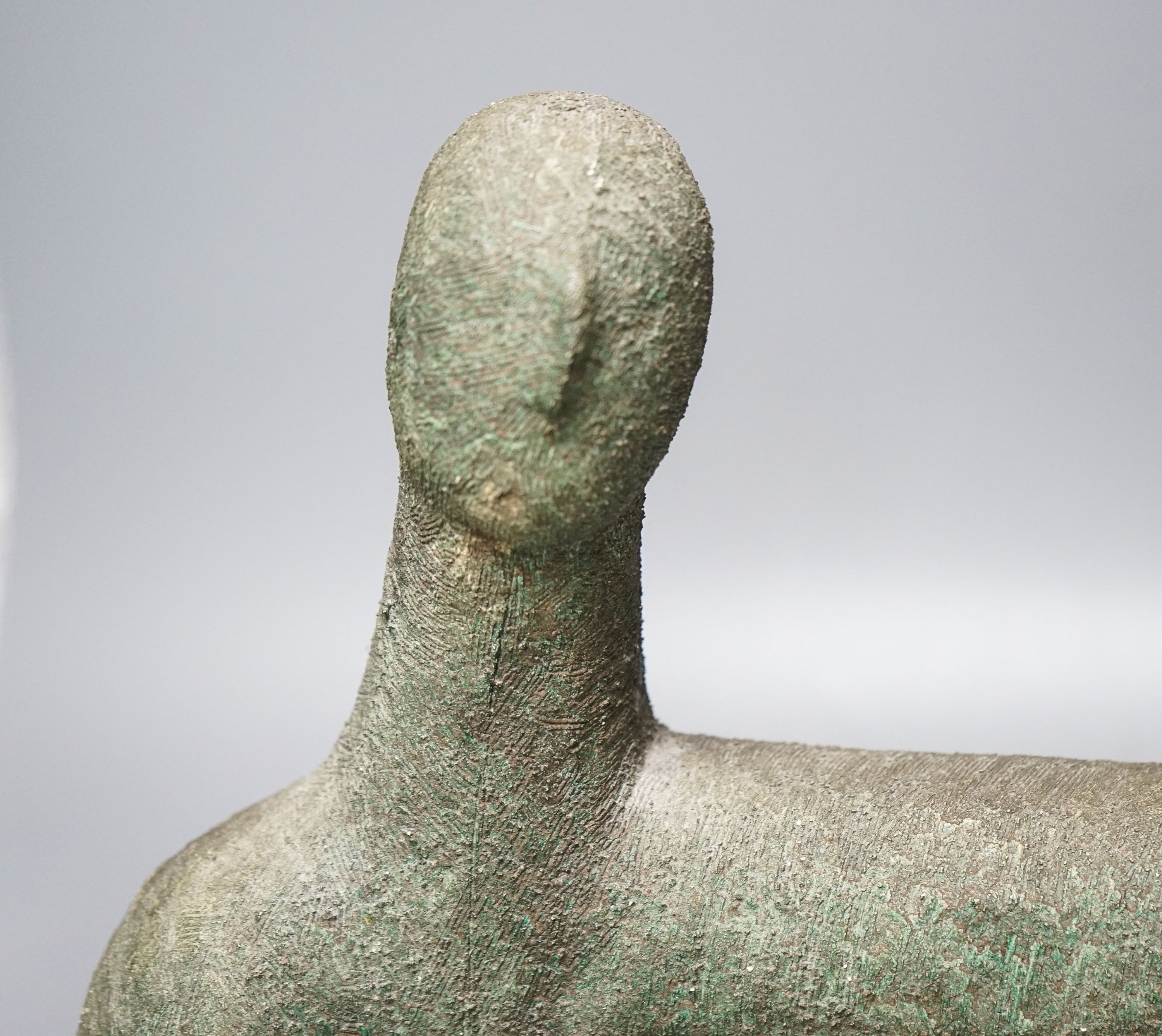 A bronzed pottery abstract figure, marked ‘WP 92’ 40cm